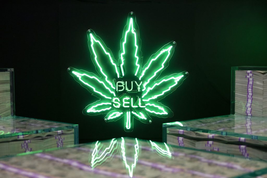 Neon sign Buy Sell with cannabis leaf